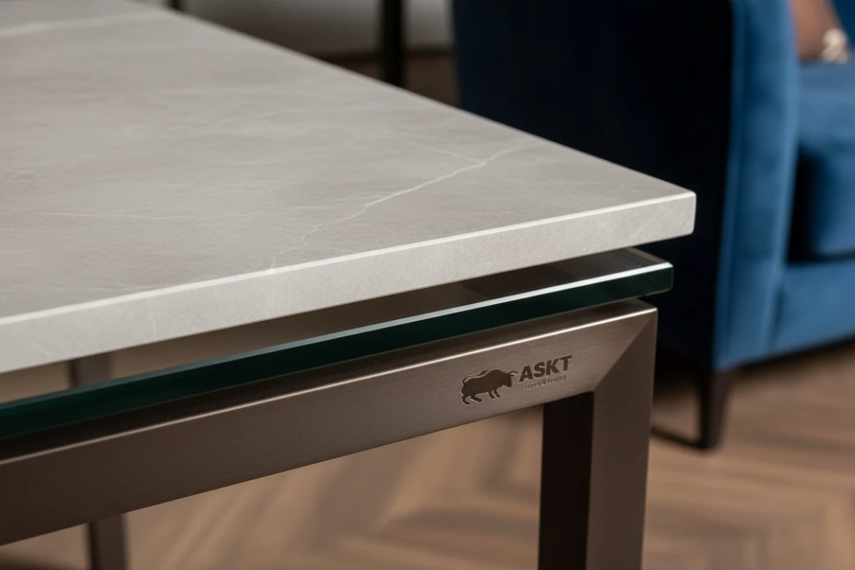 Close-up of laminated sintered stone and tempered glass table top edge
